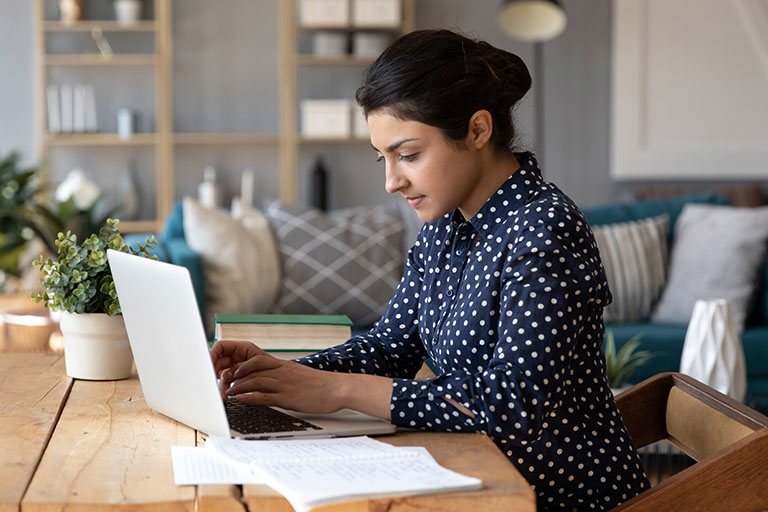 Woman studying on laptop