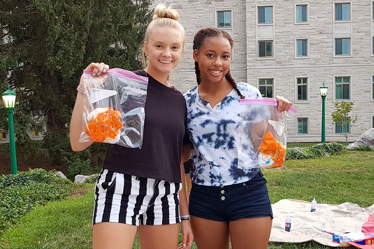 Two students in front of INSPIRE